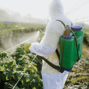 Farmer spraying crops with crop care and protection equipment